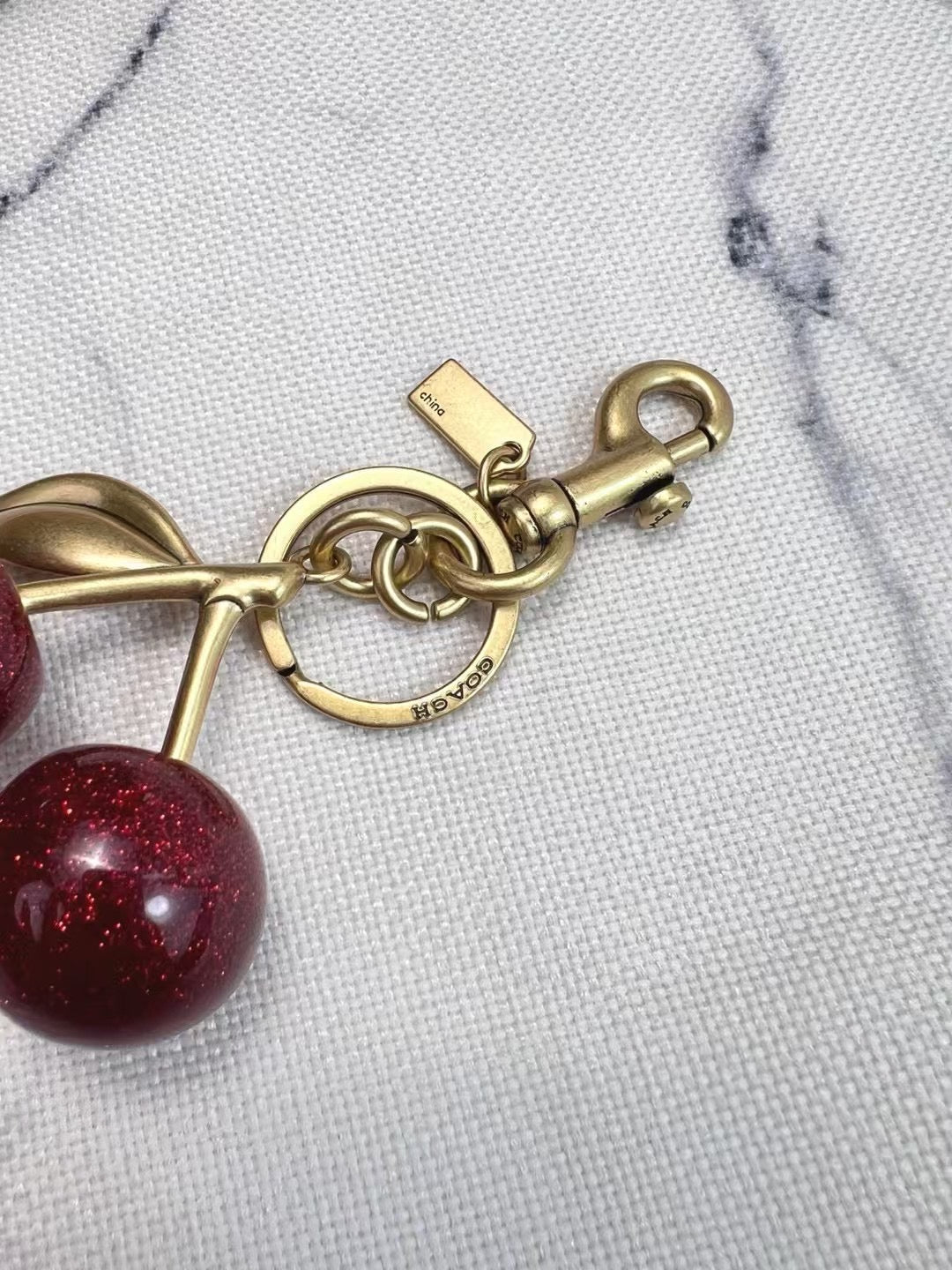 C*ach Cherry Charm Keychain