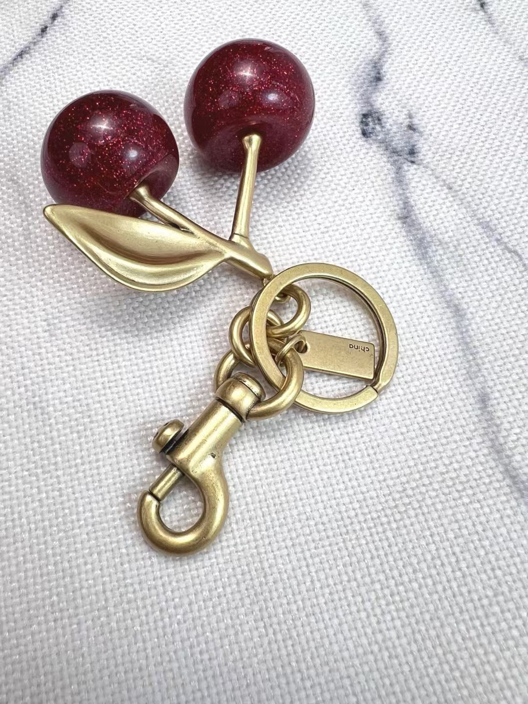 C*ach Cherry Charm Keychain