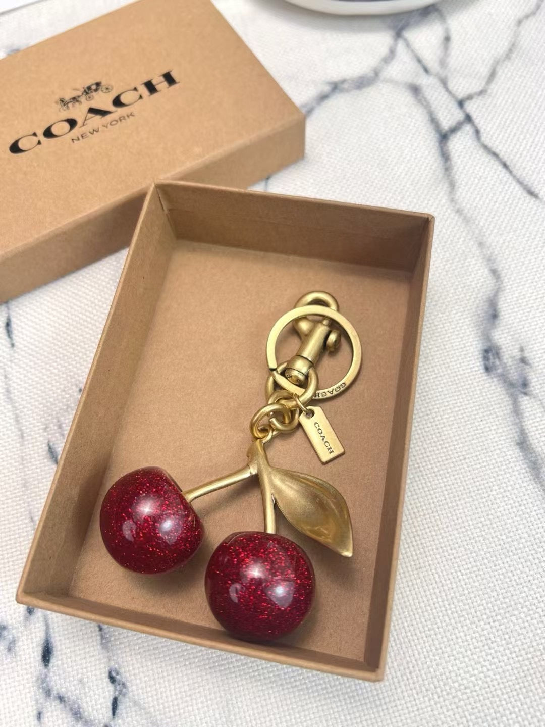 C*ach Cherry Charm Keychain